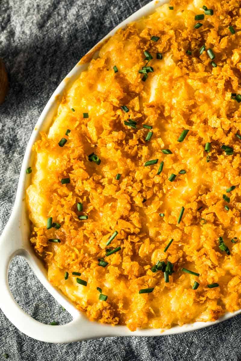 golden yellow casserole with chopped chives on top